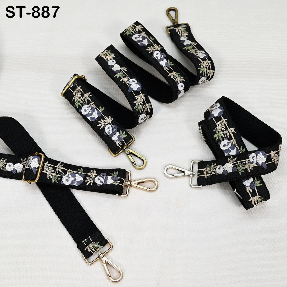 a collection of black straps with a floral pattern, featuring panda bears. The straps appear to be made of fabric and are arranged on a white background.