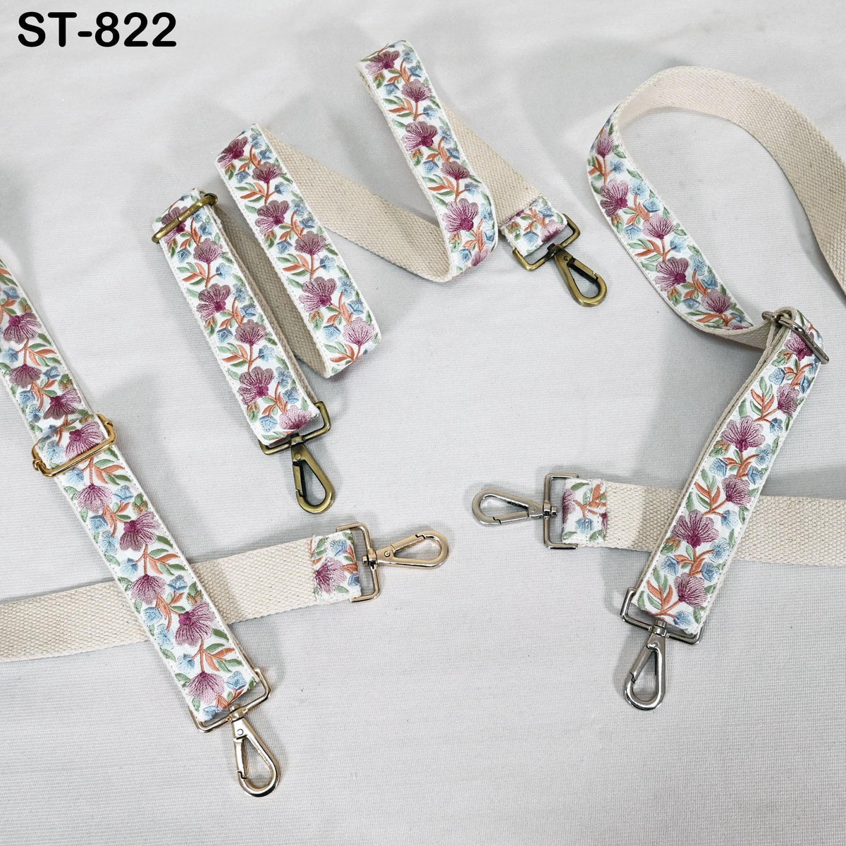 a collection of floral-patterned straps and buckles, likely intended for use as accessories or clothing items.