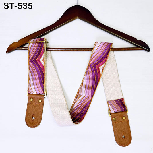 A pair of colorful suspenders hanging on a wooden hanger.