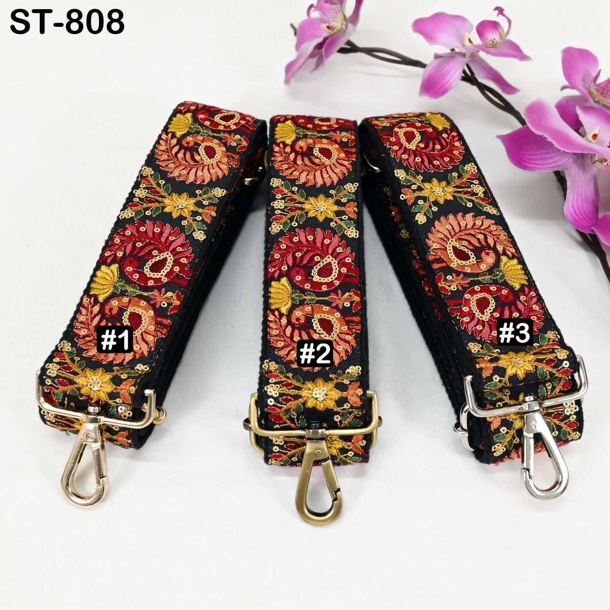 Three colorful straps with floral patterns, each with a metal clasp and hook, are displayed on a white background.