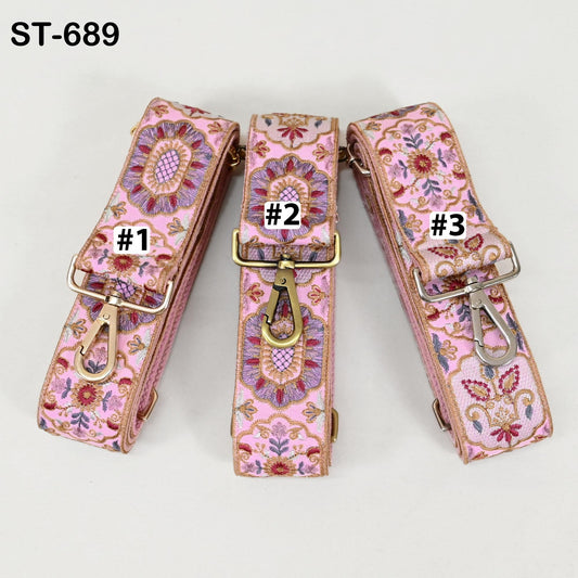 Three pink floral patterned straps with numbers 1, 2, and 3 printed on them, each with a metal clasp and hook.
