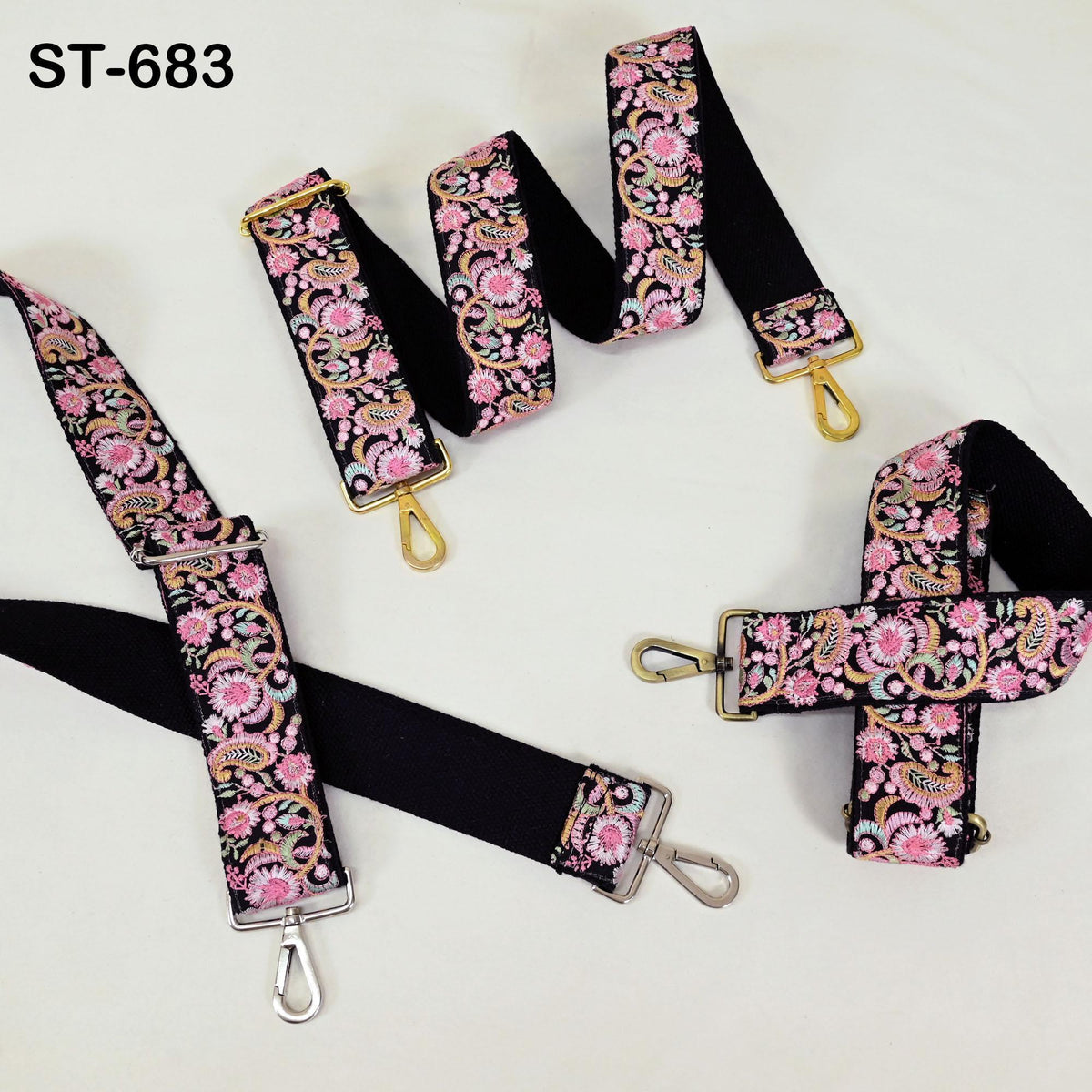 a collection of colorful floral-patterned straps, including black straps with gold hardware, arranged on a white background.