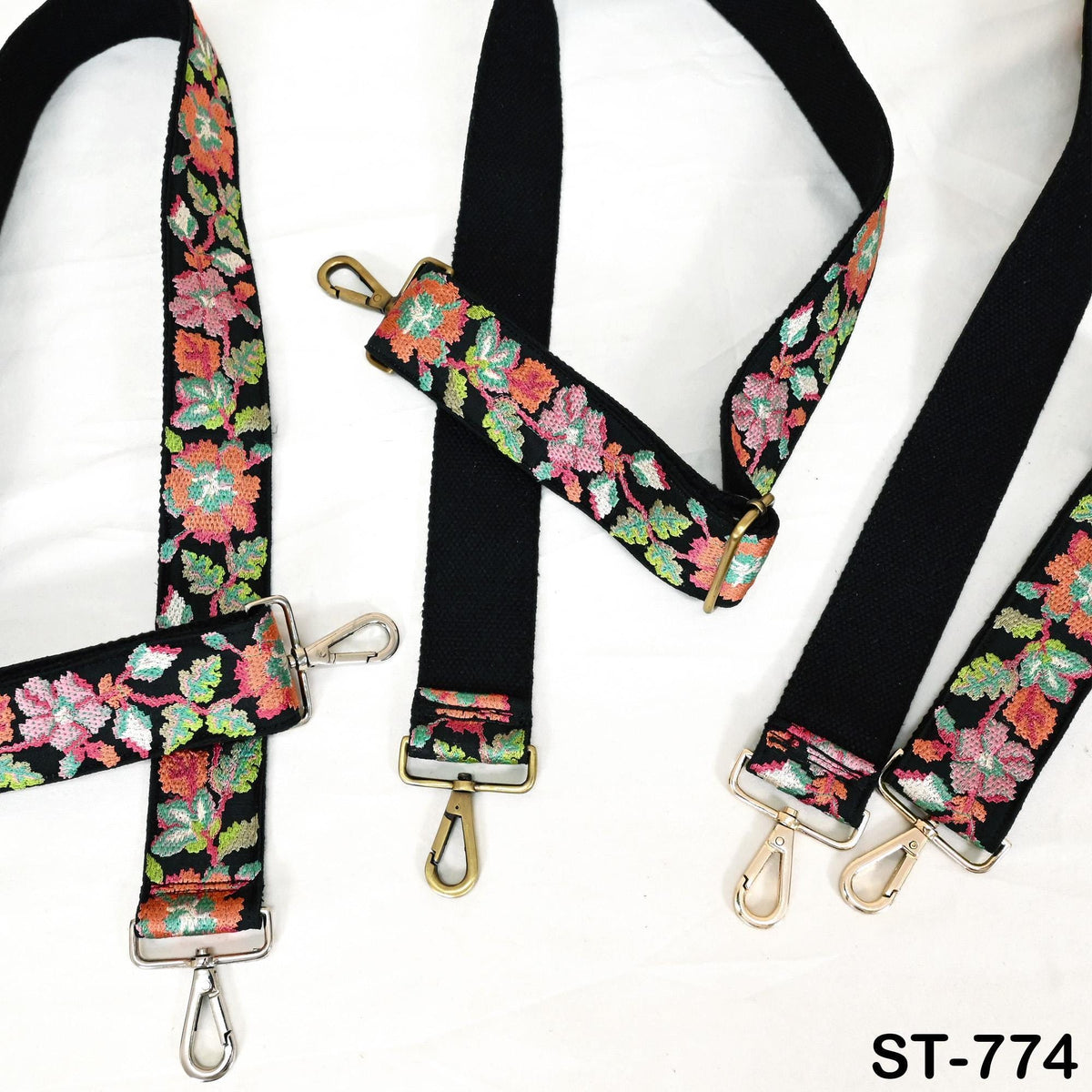 a collection of colorful floral-patterned straps, each with a metal clasp and hook. The straps appear to be made of fabric and are arranged on a white background.
