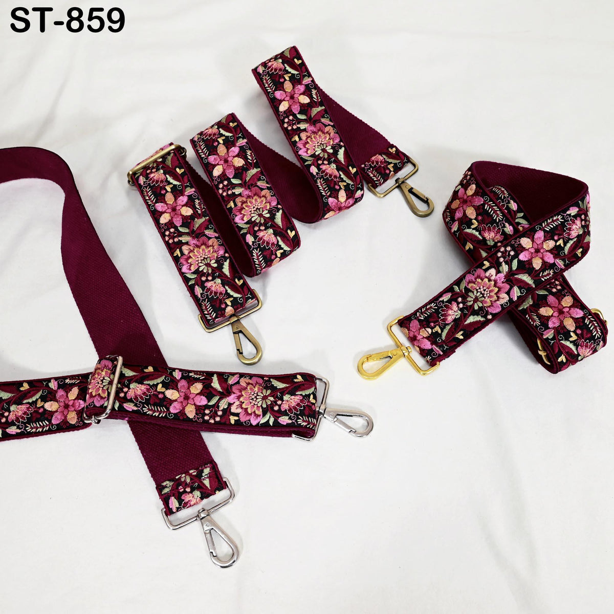 a collection of burgundy-colored straps with floral patterns, arranged on a white background.