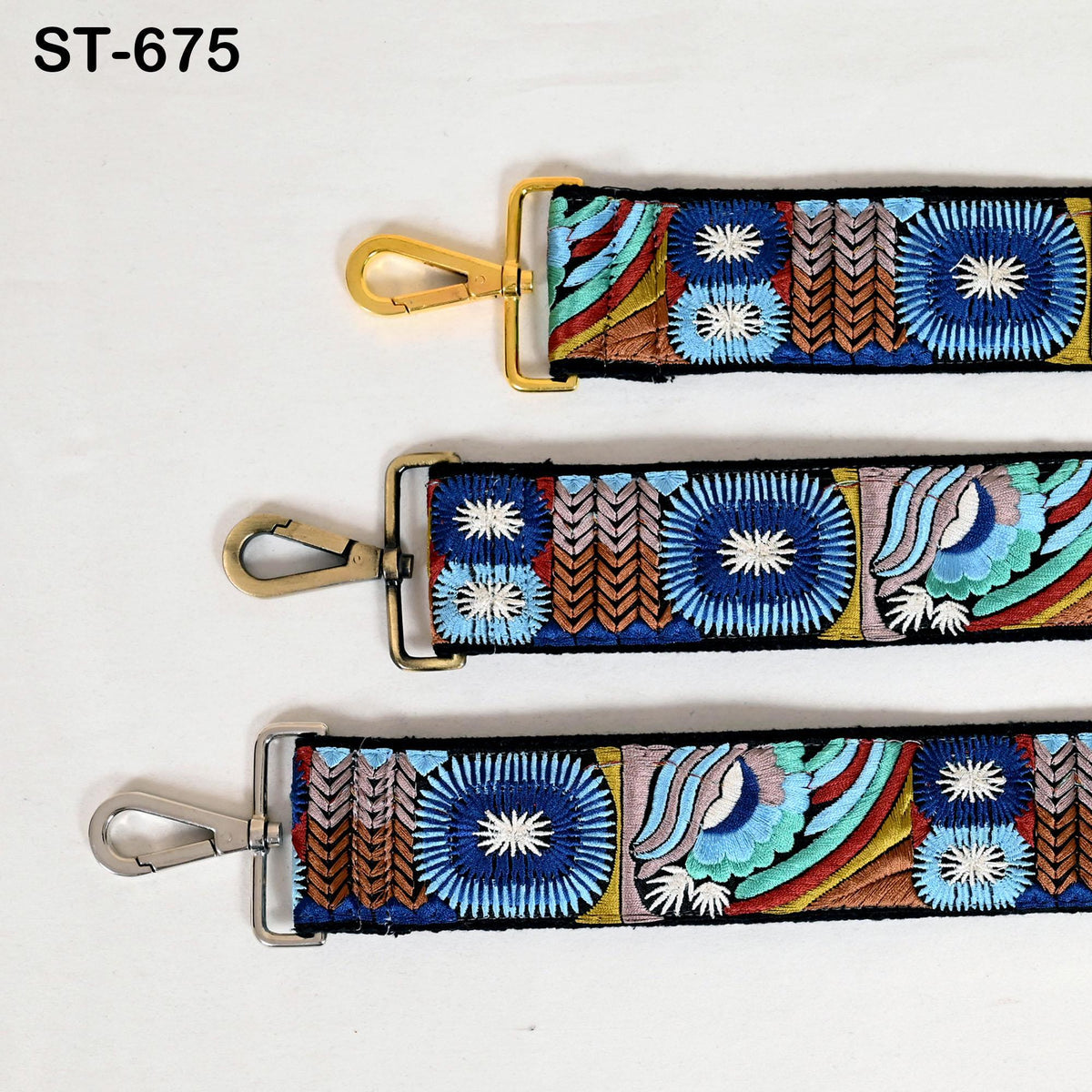three colorful straps with intricate embroidered patterns, each featuring a unique design.