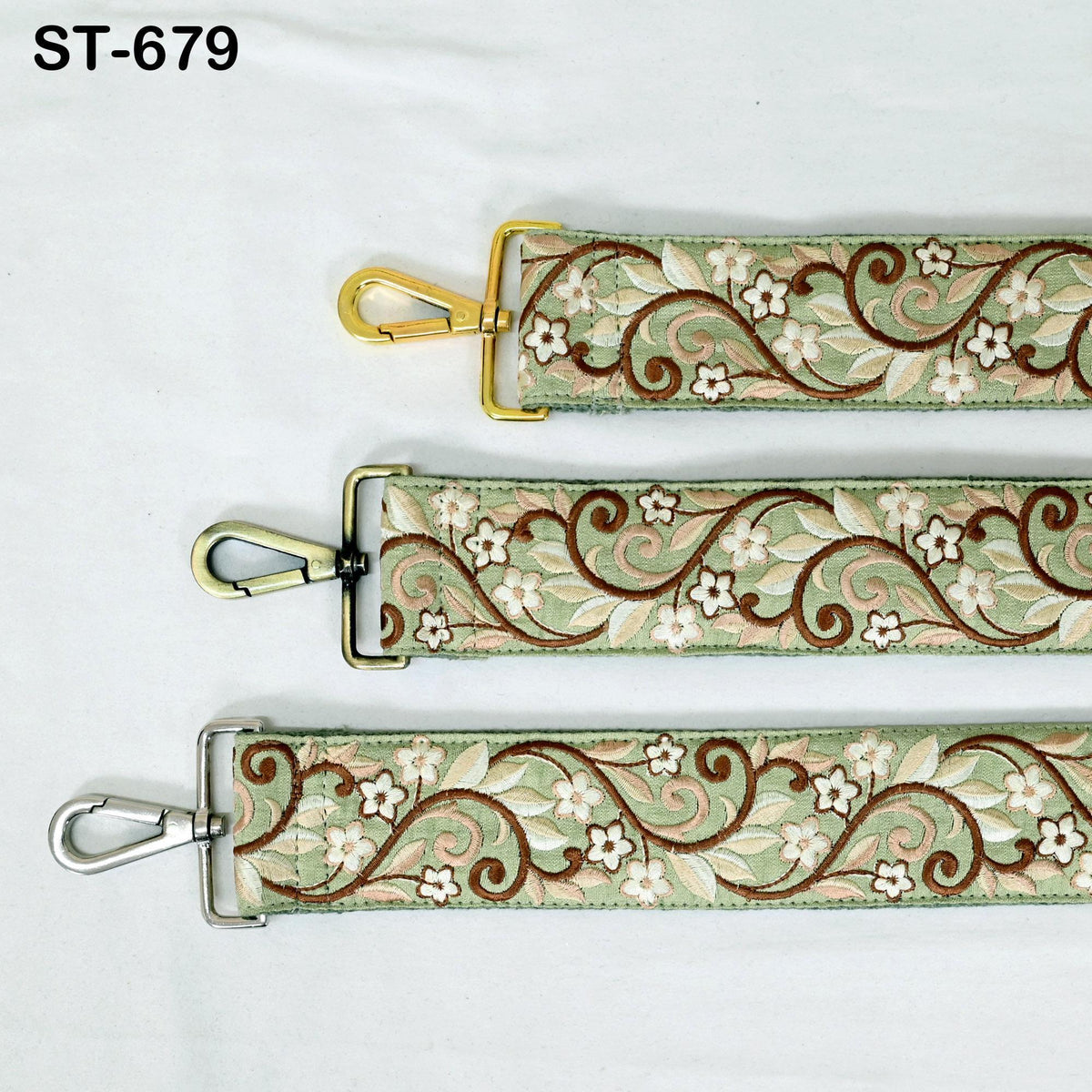 three straps with floral embroidery patterns in different colors, including green, brown, and white.