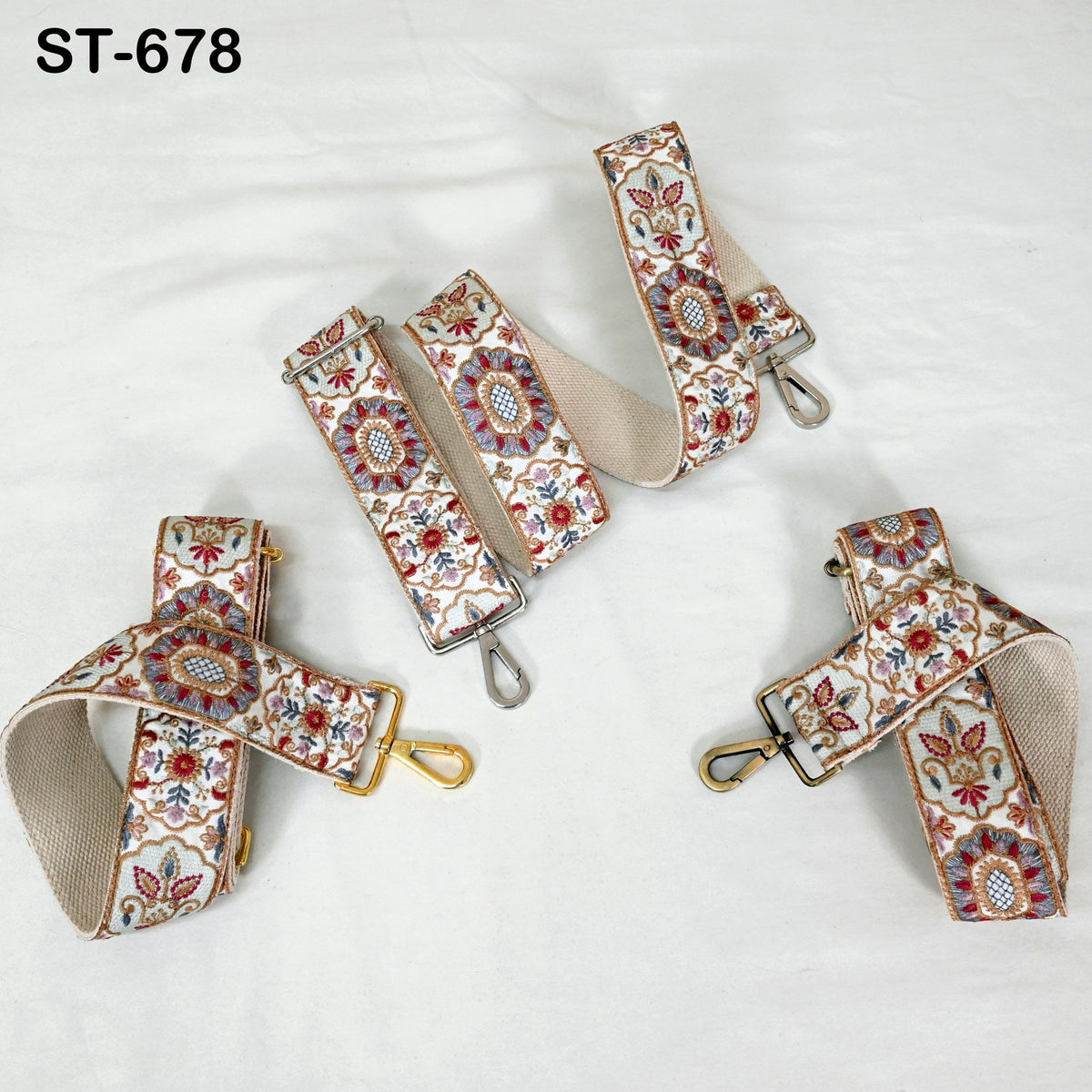 a collection of patterned straps, including a beige strap with a floral design and a gold-colored strap with a similar floral design.
