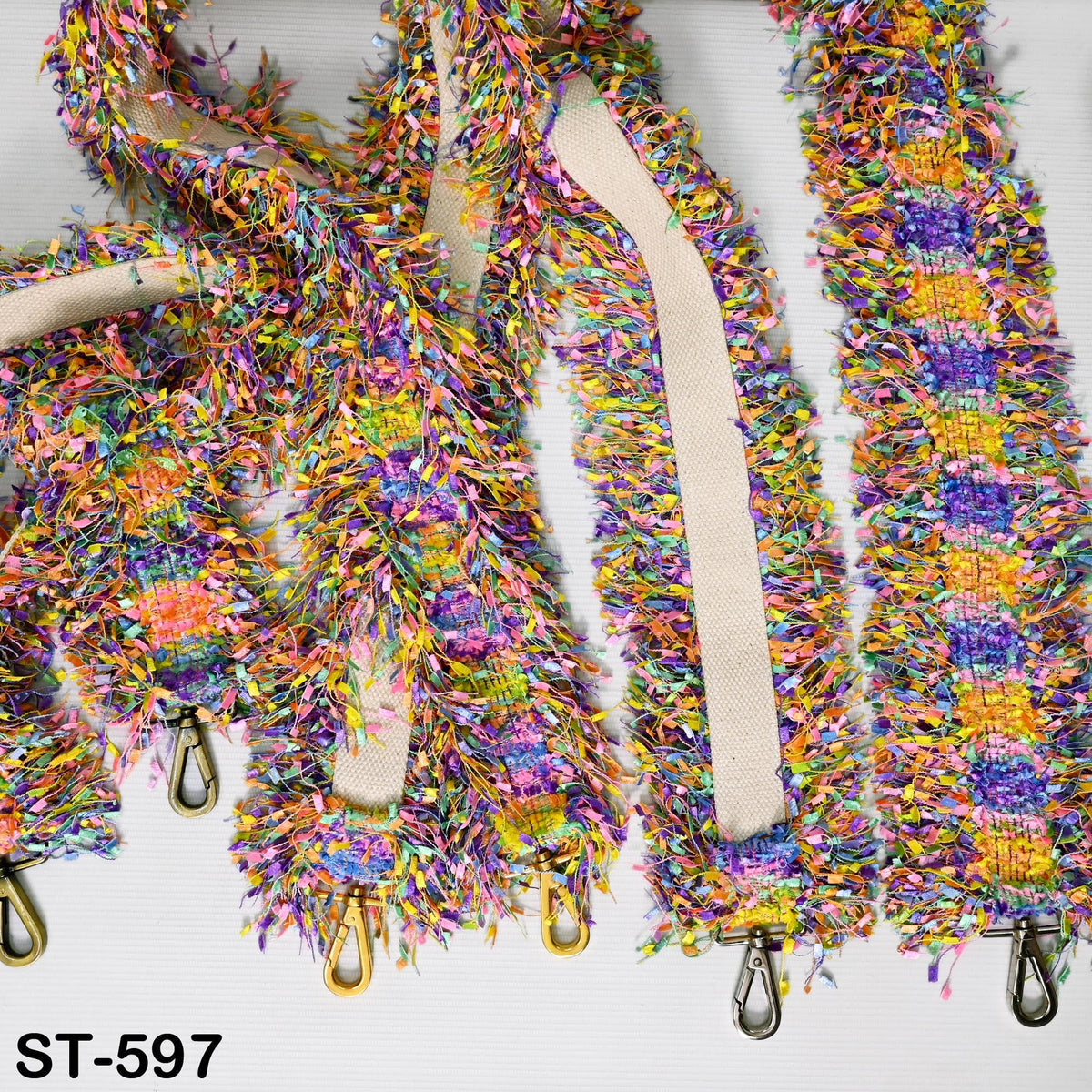 a colorful, multicolored strap with a fringed texture, possibly made of fabric or yarn.