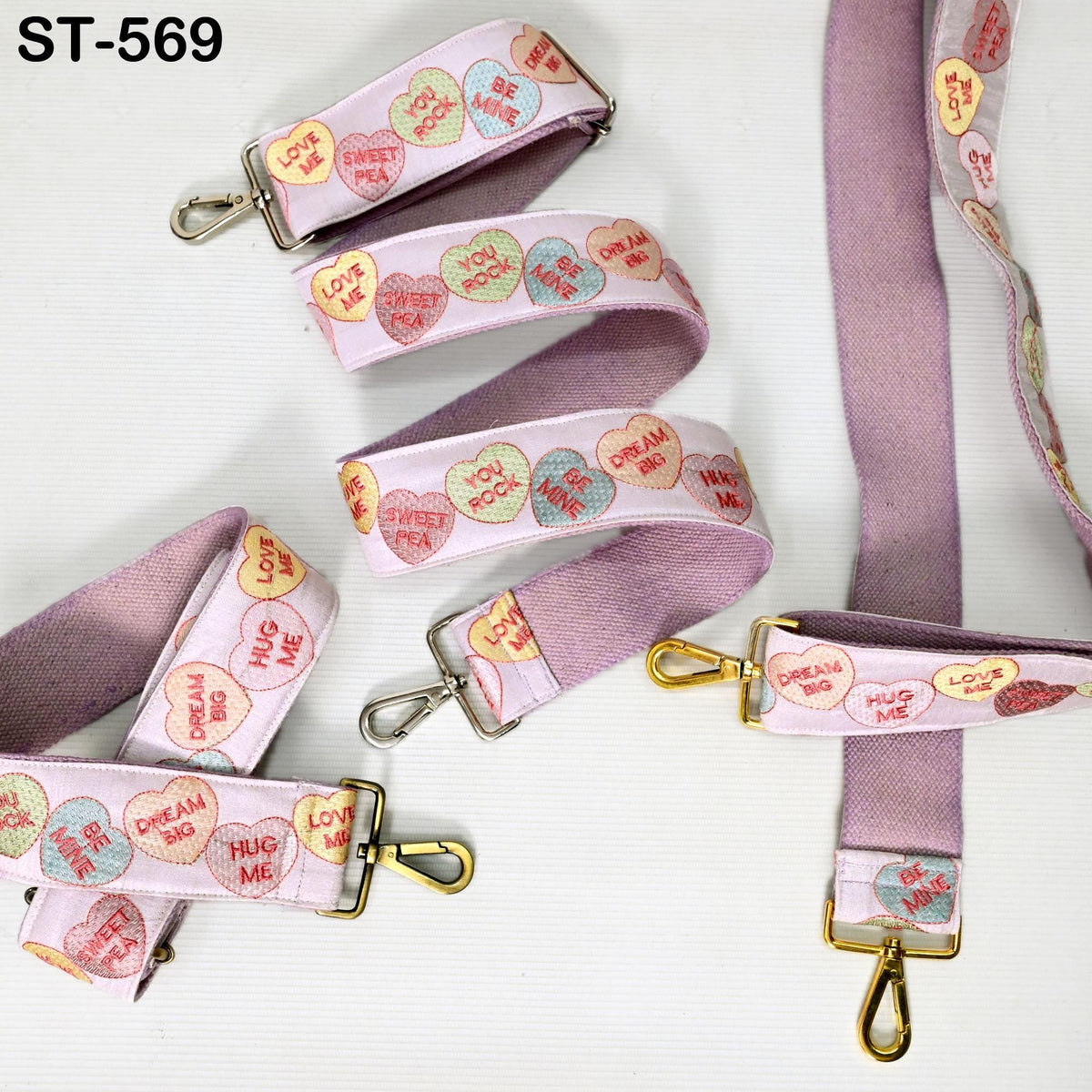 a pink leash with hearts and words on it
