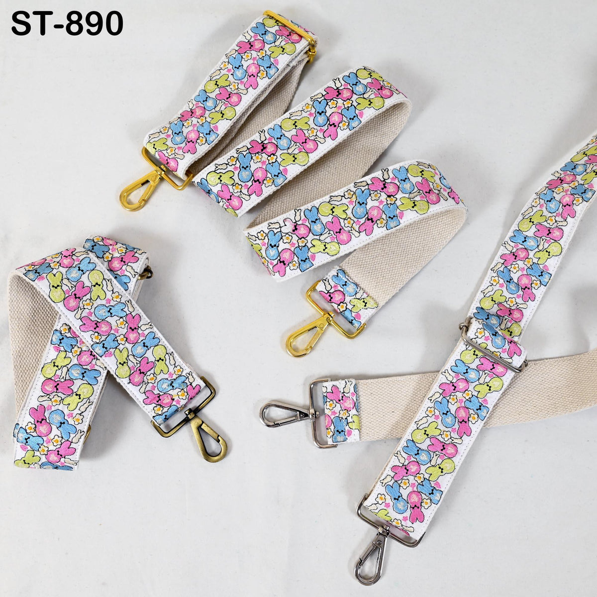 a collection of colorful straps with floral patterns, including a strap with a yellow buckle and a strap with a silver buckle.