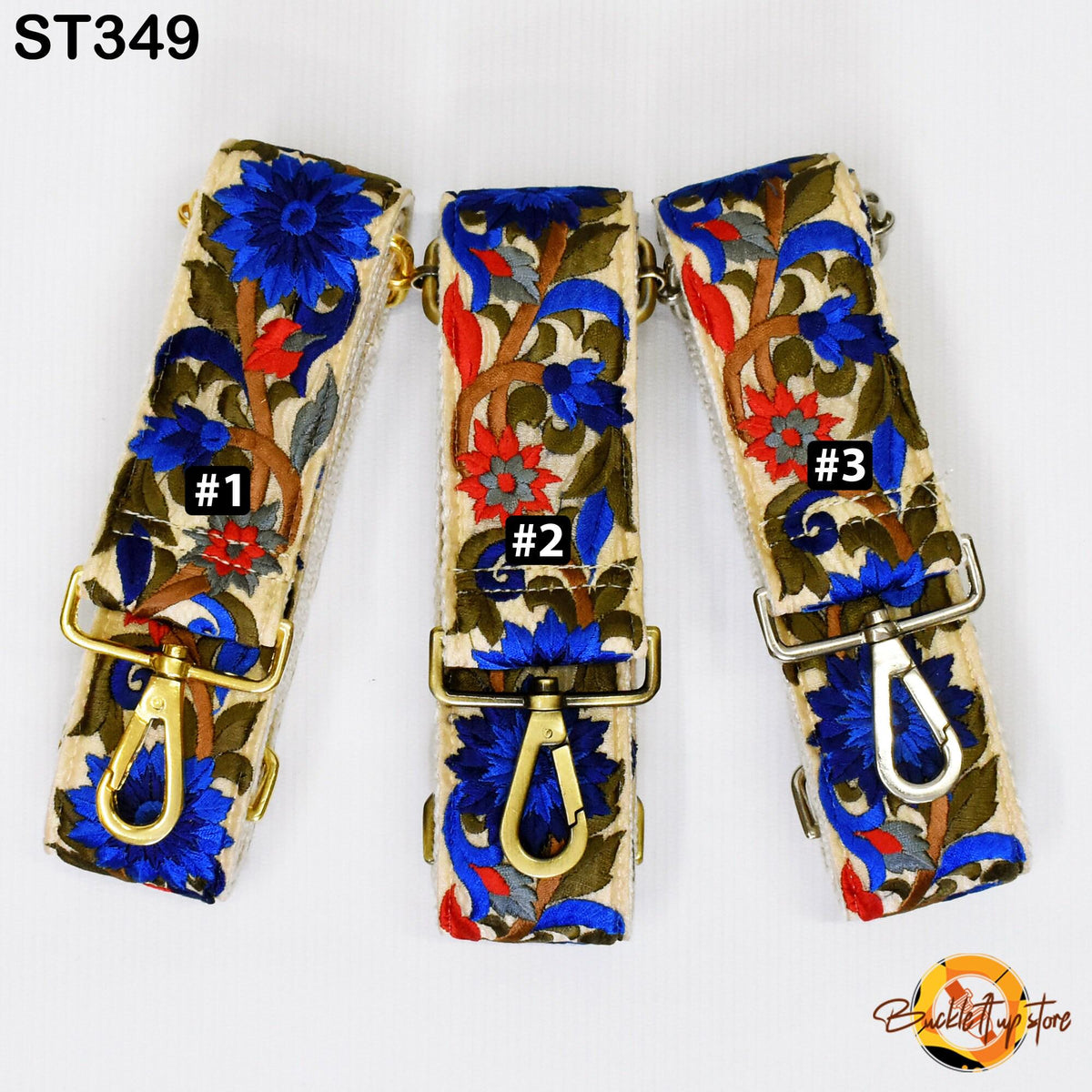 Three colorful straps with floral designs, each with a gold clasp and a small black number on it.