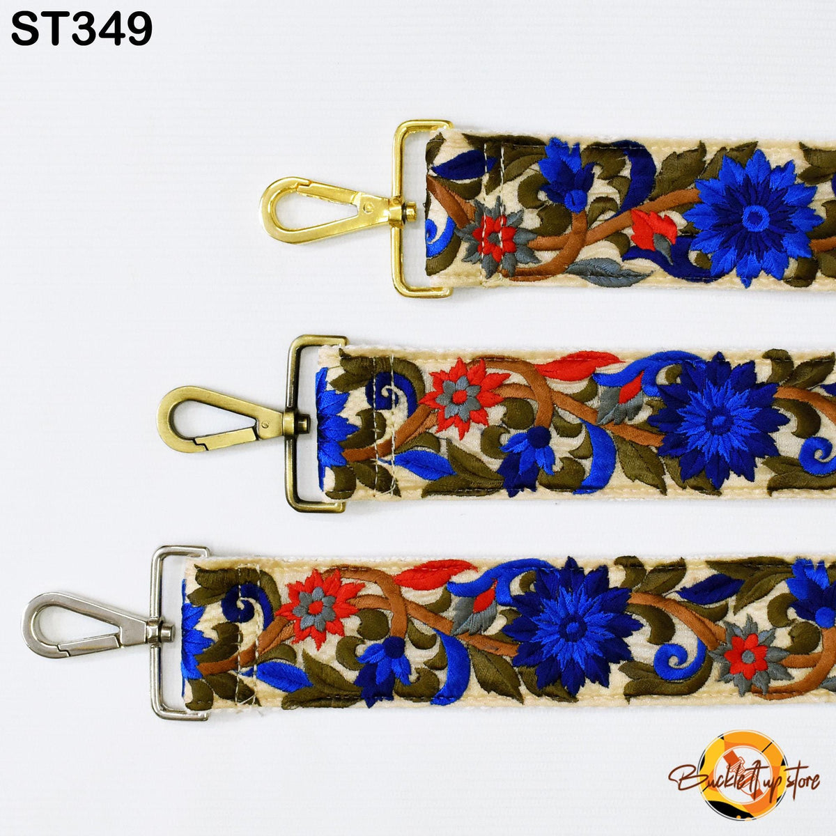 three straps with floral embroidery in blue, red, and green colors. The straps have metal buckles and hooks, and the straps are arranged in a row.
