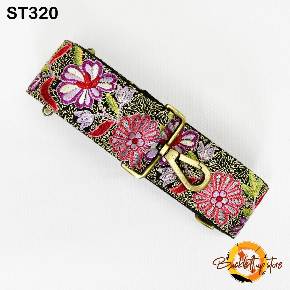 A colorful floral patterned strap with a gold buckle, displayed against a white background.