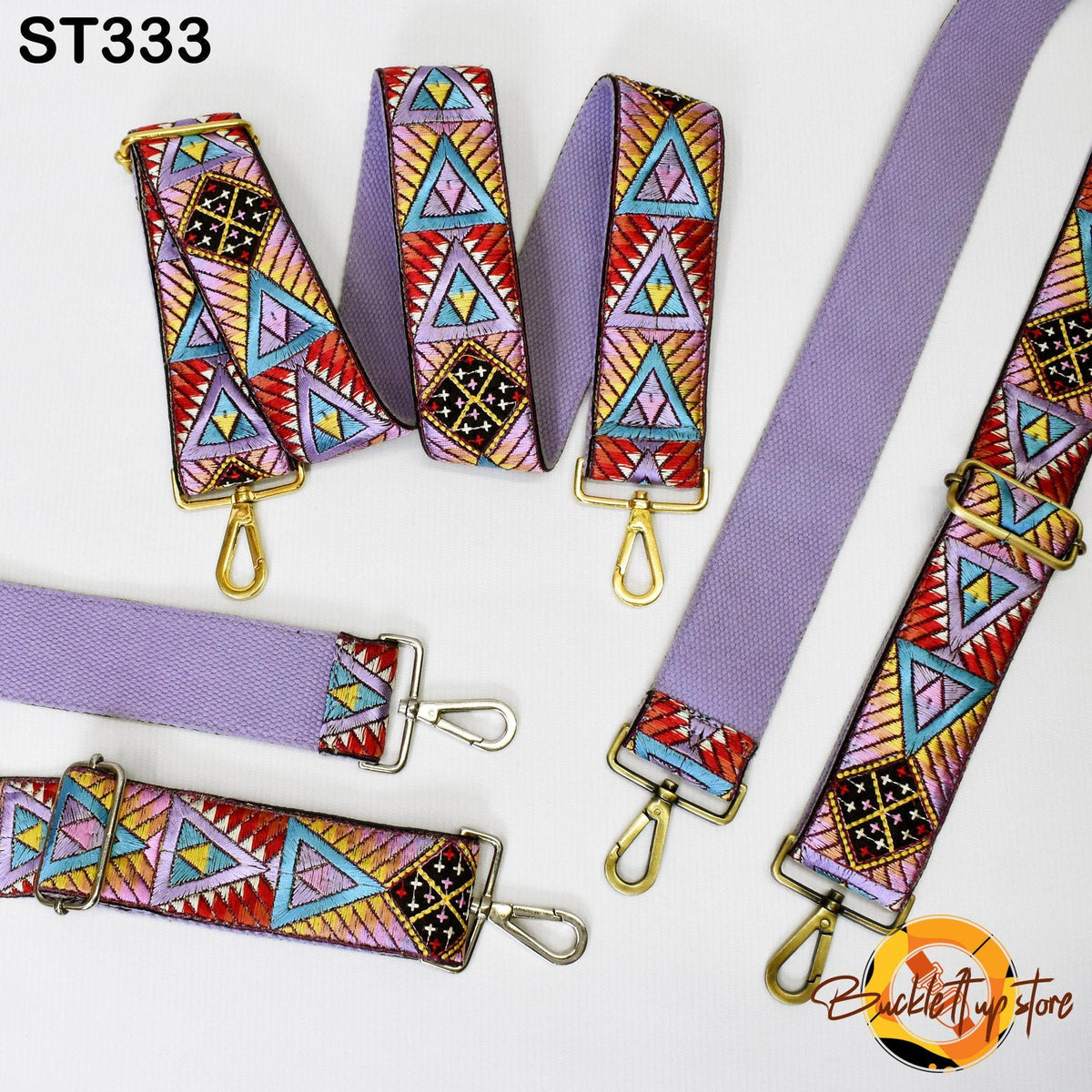 a collection of colorful patterned straps, including a purple strap with a geometric design and a gold-colored strap with a similar pattern.