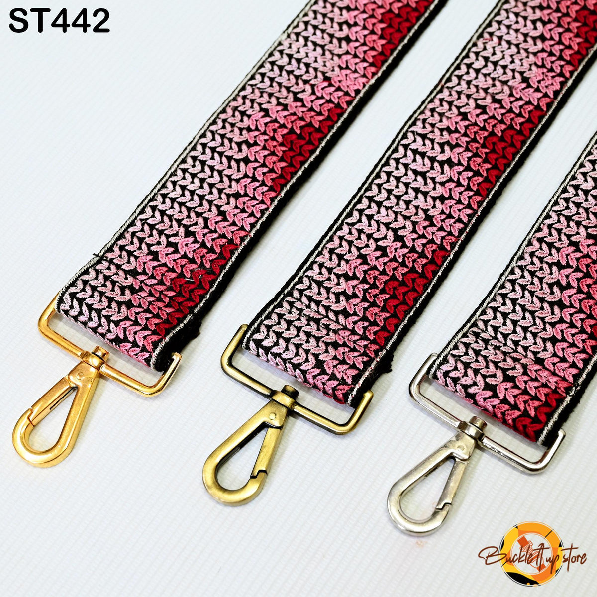 three colorful straps with metal hooks, arranged side by side.