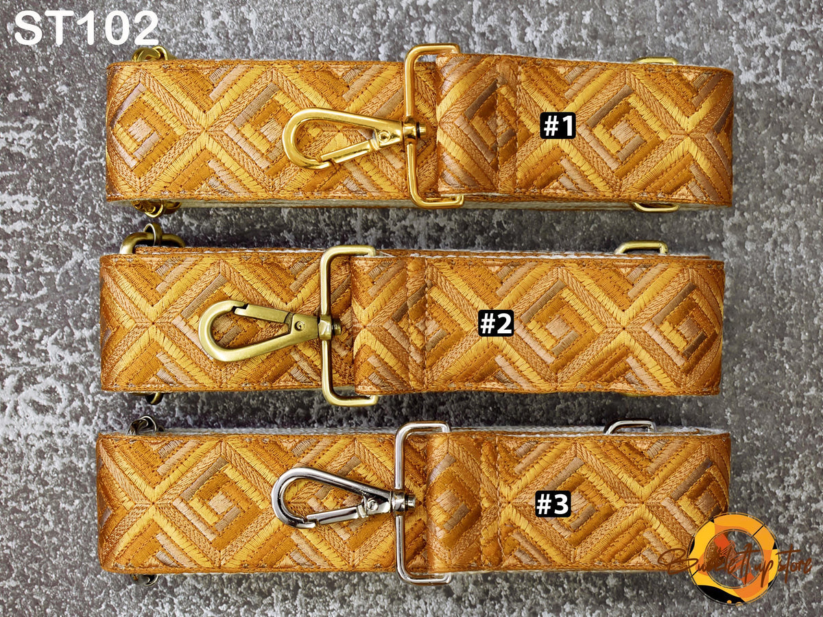 three different straps with a geometric pattern, each with a unique number printed on it.