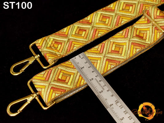 a colorful patterned strap with a ruler placed next to it, indicating the strap's size or length.