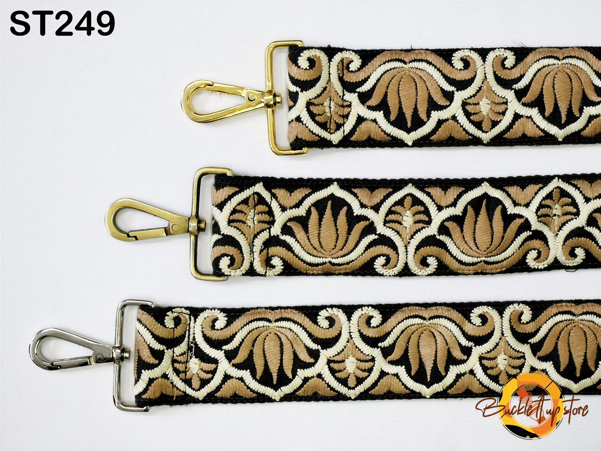 three straps with a floral pattern in shades of brown and white. The straps have gold metal clasps and buckles, adding a touch of elegance to the design.
