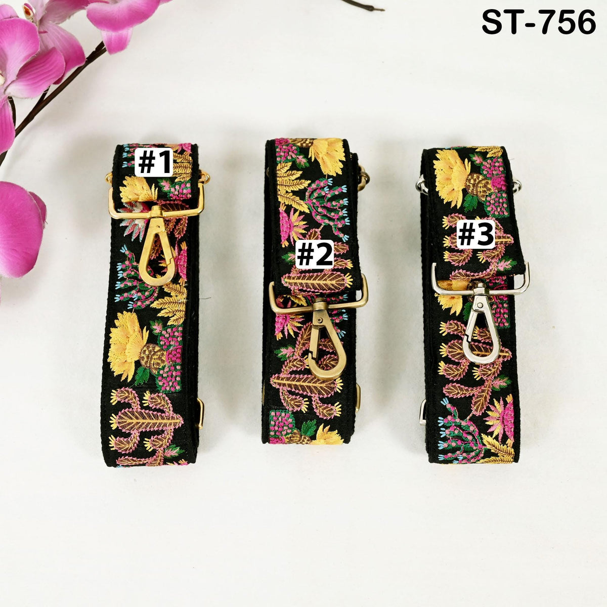 Three colorful floral straps with numbers on them, placed on a white background.