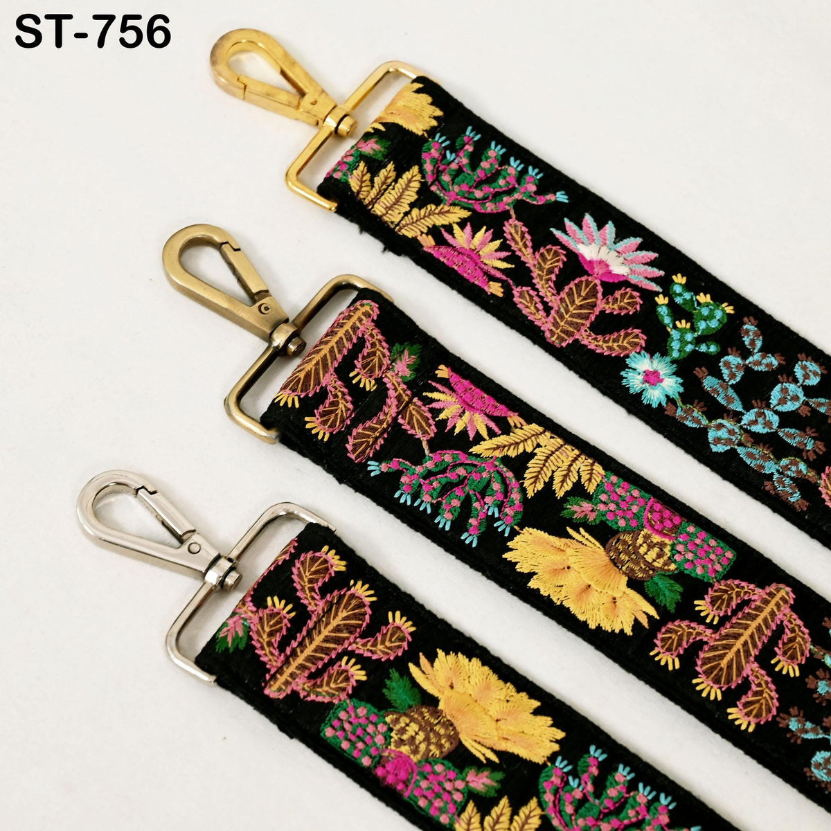 three colorful straps with floral embroidery, each with a metal clasp and hook.