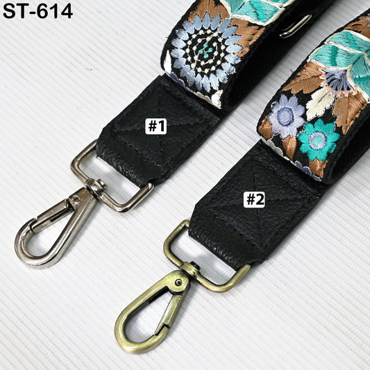two straps with floral designs, one with a black strap and the other with a floral pattern on a black strap.