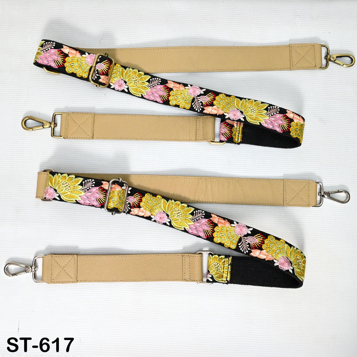 a set of beige straps with floral patterns, arranged on a white background.