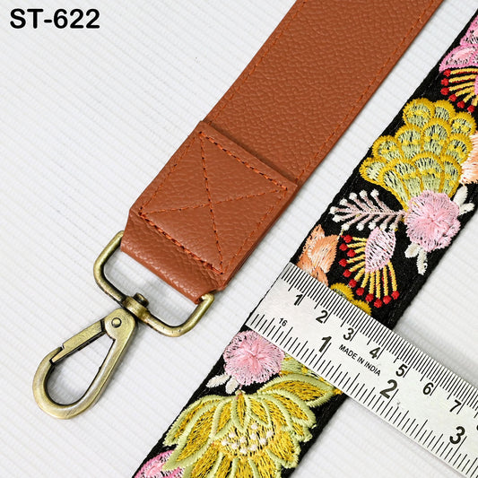 a brown leather strap with a metal hook and a ruler placed next to it, indicating the strap's size.