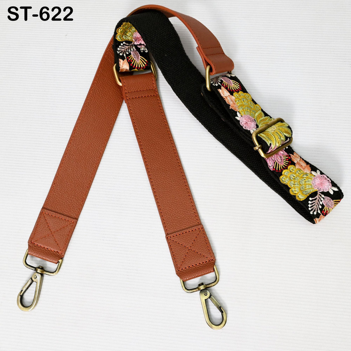 A brown leather strap with a floral pattern and a black strap with a floral pattern are shown against a white background.