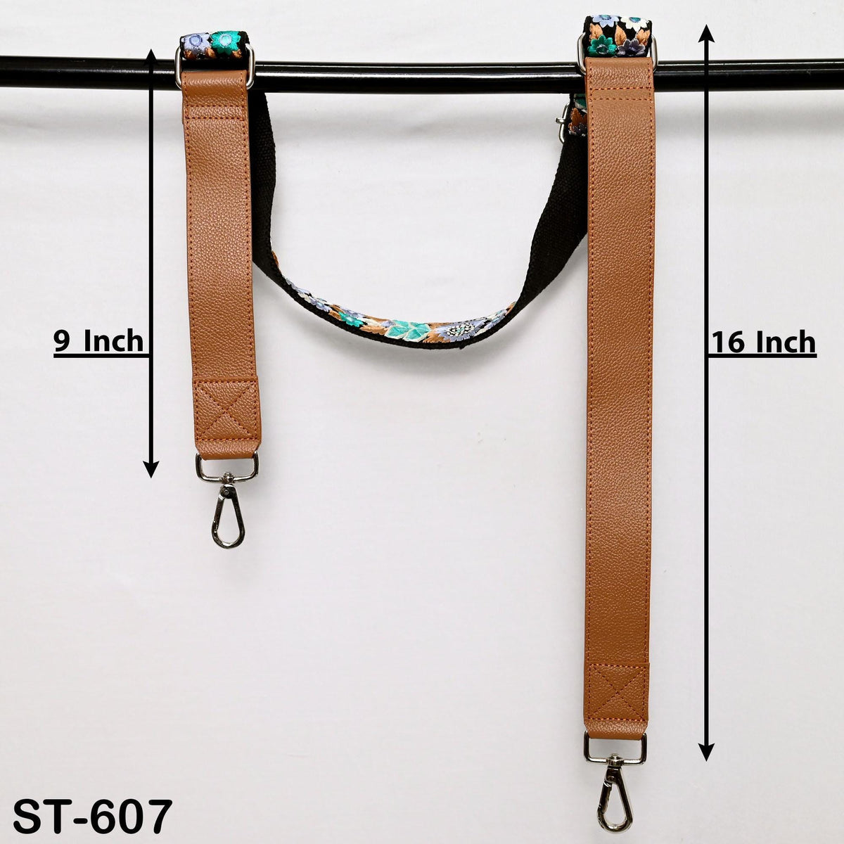 two brown leather straps with metal hooks attached, hanging on a black bar. The straps are labeled with measurements, indicating they are 9 inches and 16 inches long.