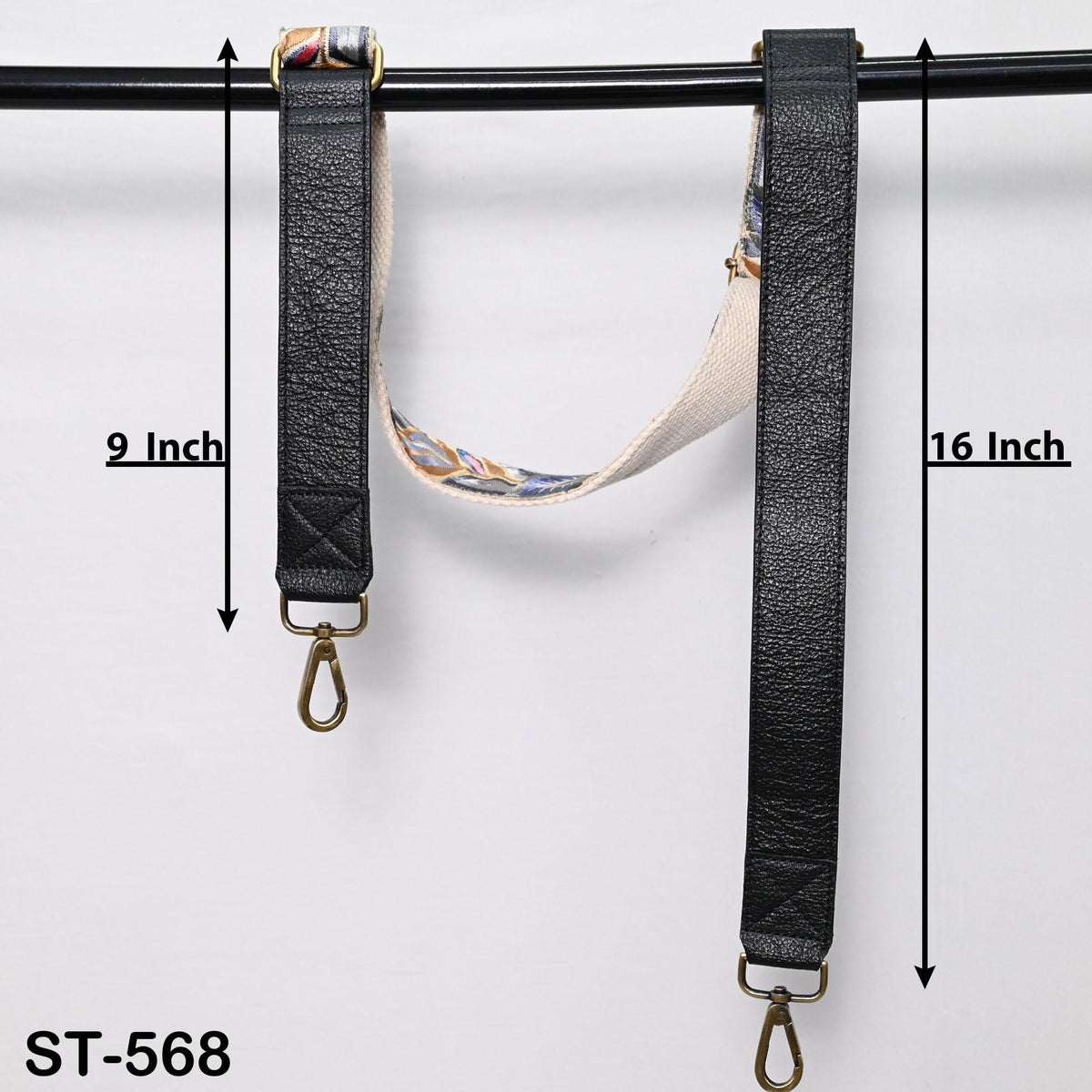 two black leather straps with metal hooks attached, hanging on a black rod. The straps are labeled with measurements, indicating they are 9 inches and 16 inches long.