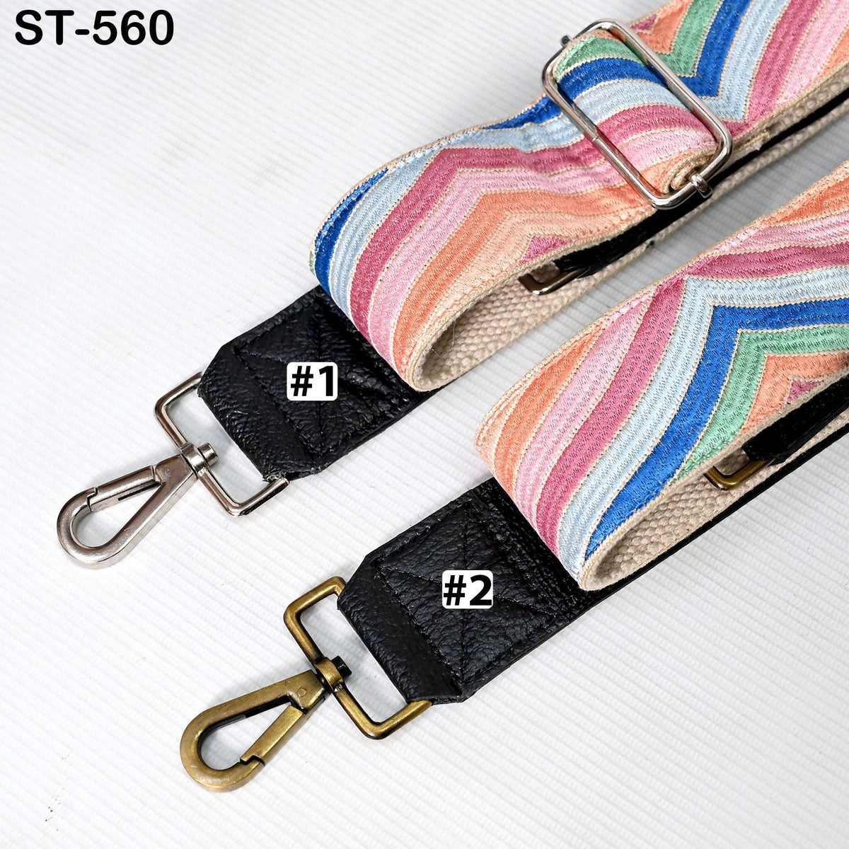 two colorful straps with metal buckles, one with a black strap and the other with a striped strap, both featuring the number "1" and "2" printed on them.