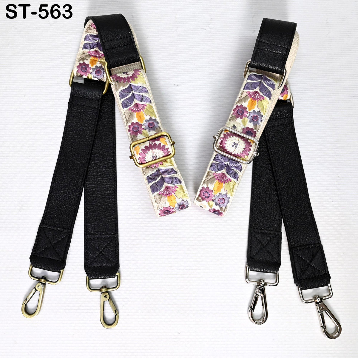 two straps with floral patterns, one black and one white, both with metal buckles and hooks.