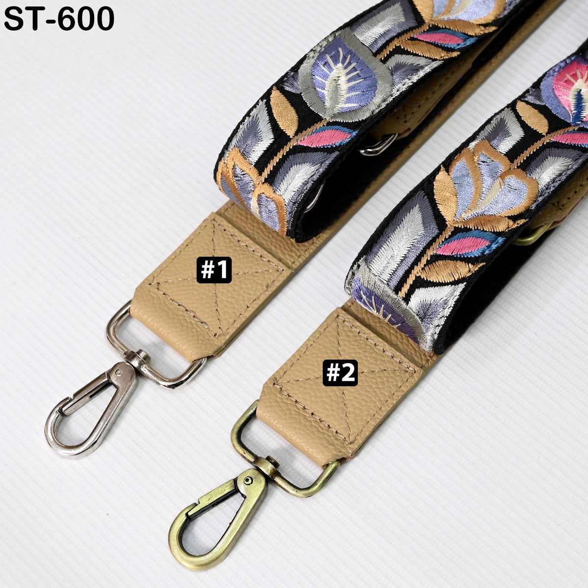 two straps with floral designs, one with a beige strap and the other with a black strap. The straps have metal hooks and buckles, and there are labels indicating the number 1 and 2.